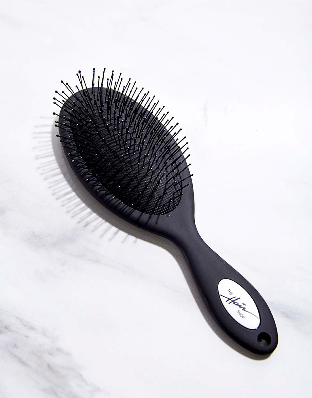 http://thehairshop.com/cdn/shop/products/ths_detangling_brush_the_hair_shop_1__17449.1632342472.1280.1280_1024x.jpg?v=1678441610