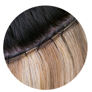 Close-up of Classic Weft extensions applied on head
