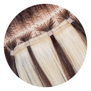Close-up of One-Step Weft extensions applied on head
