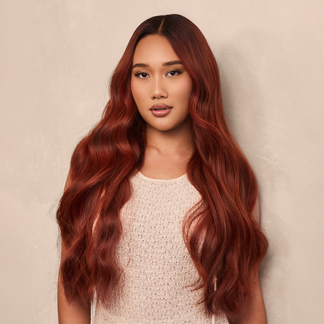 After Portrait image of model wearing HĪEW 07 - Refined Red hair extension.