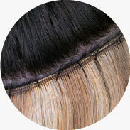 Close-up of Classic Weft extensions applied on head