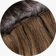 Close-up of Hand-tied Weft extensions applied on head