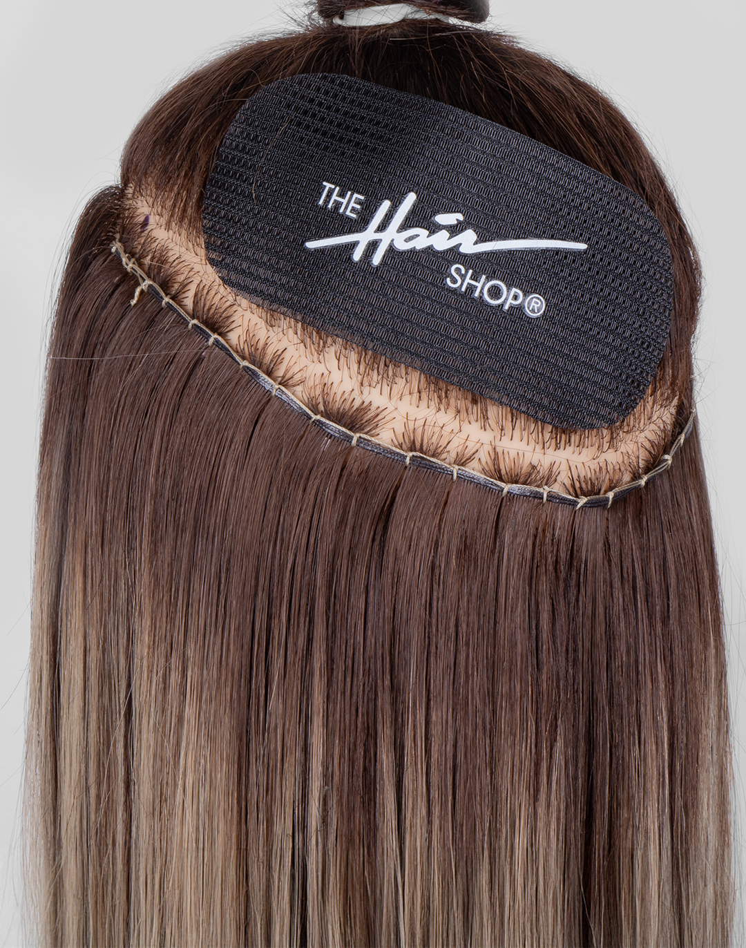 Smart Weft™ extension with Hair Gripper application shot. 