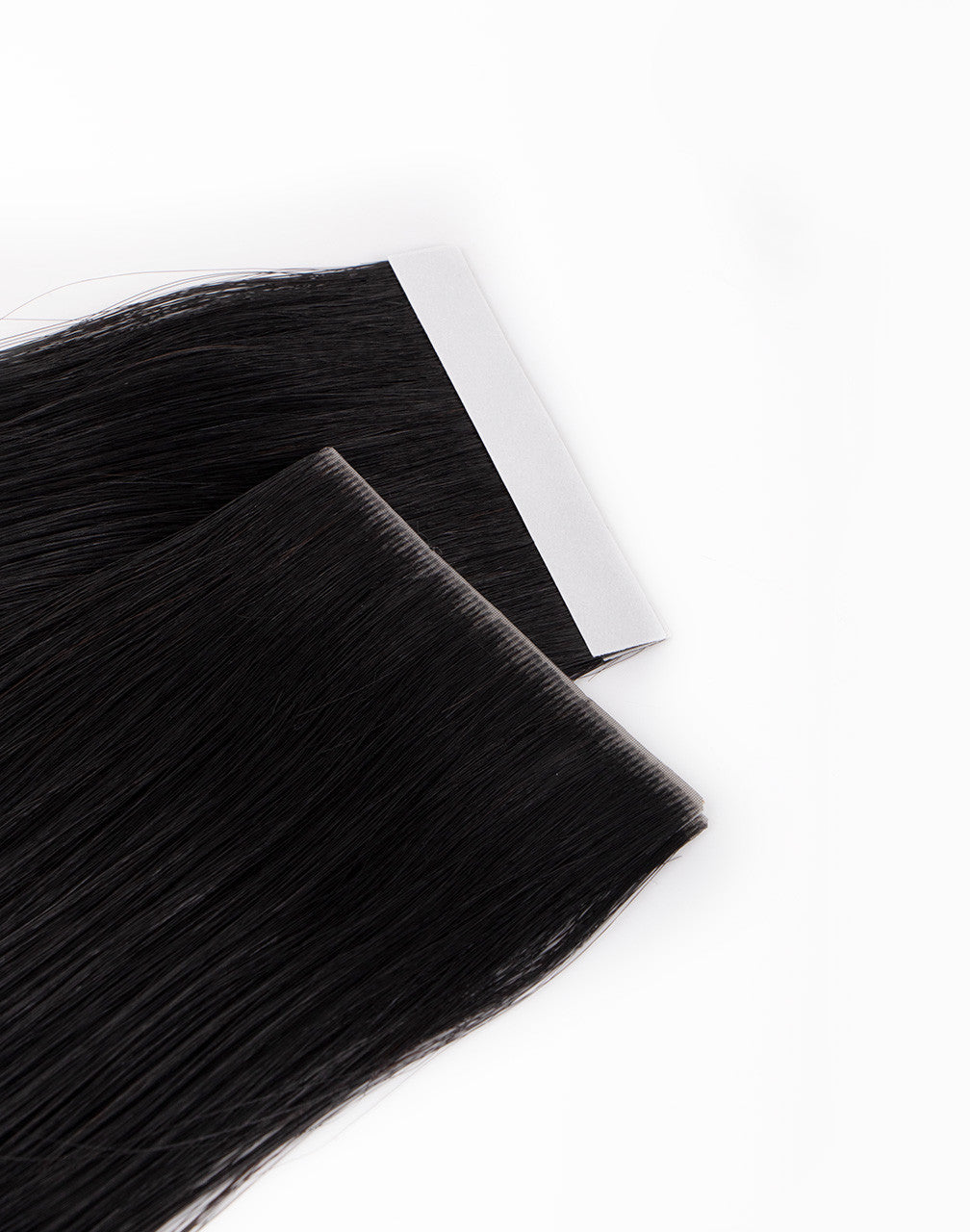 front and back of black skinweft tape extensions