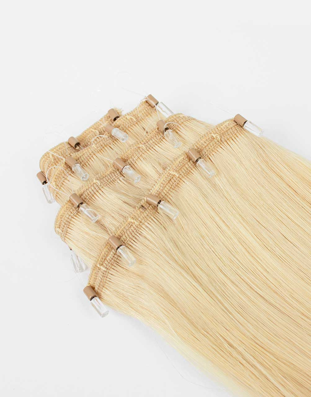 close up row of one-step-weft blonde extensions