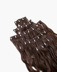 row of one-step-weft brunette extensions