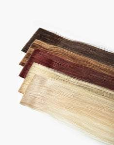 rows of skinweft tape in extentions with a variety of colors