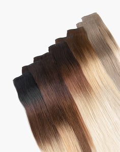 row of pro 7 clip-in® set bundle extensions in a variety of colors